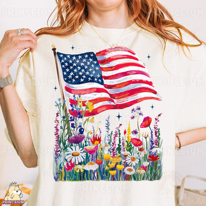 a woman wearing a patriotic t - shirt holding a flag