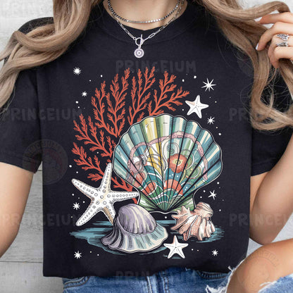 a woman wearing a t - shirt with a seashell and starfish on it