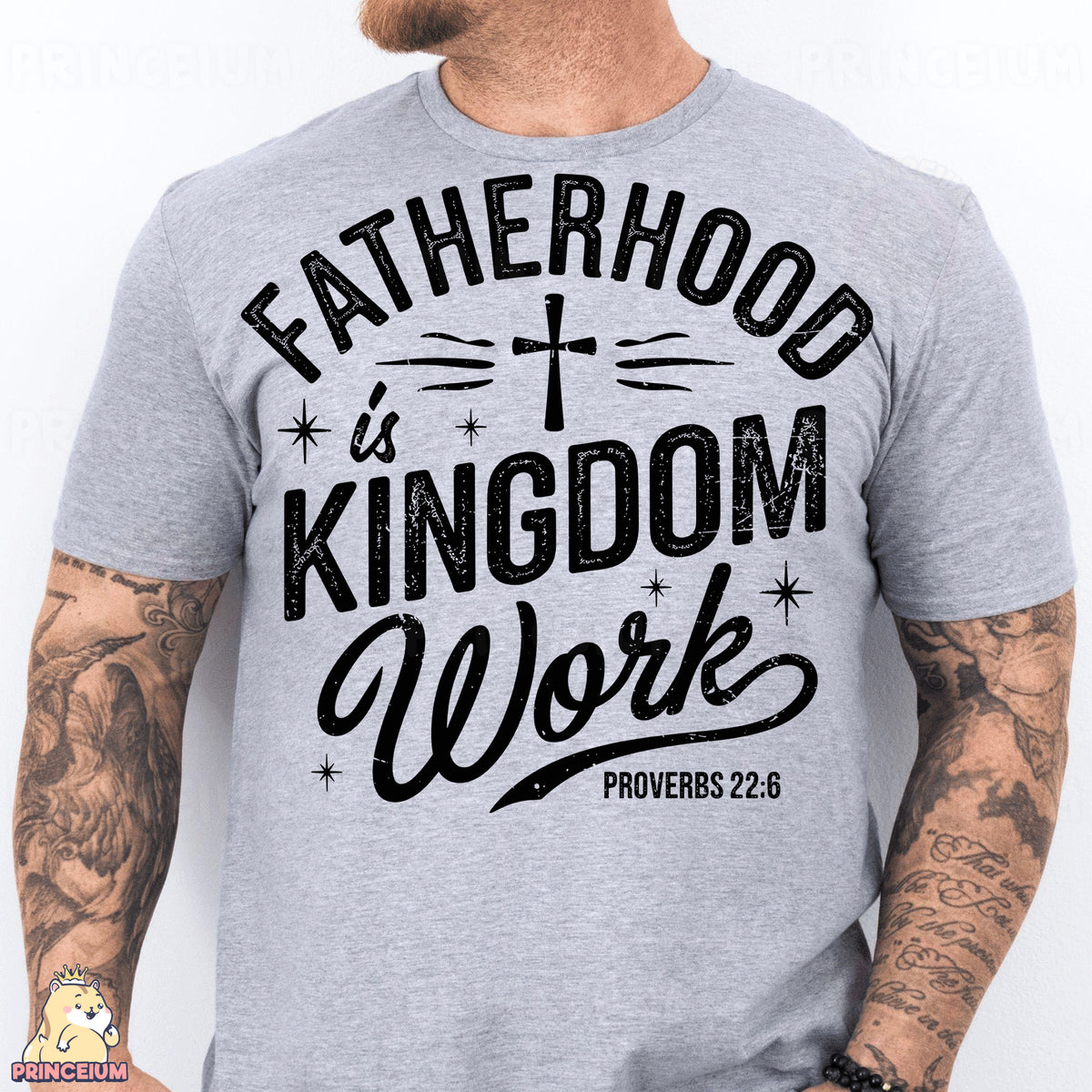 a man wearing a t - shirt that says fatherhood is kingdom work