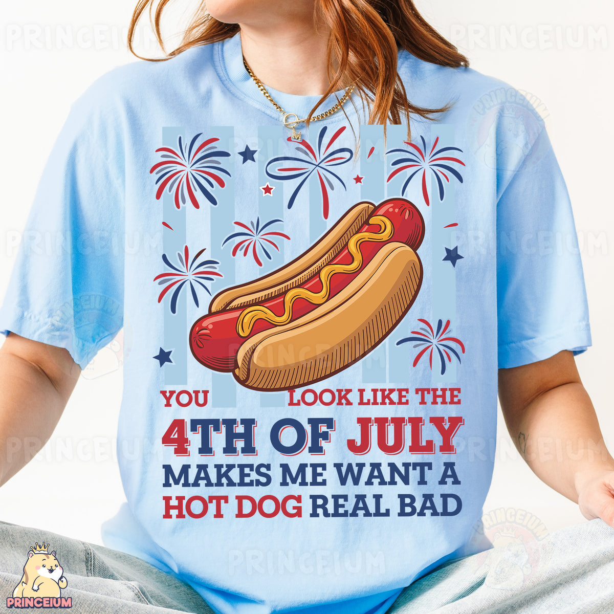 a woman wearing a blue shirt with a hot dog on it