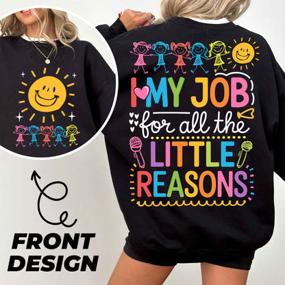 a woman wearing a black sweatshirt with the words, my job for all the little
