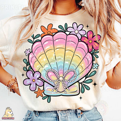 a woman wearing a t - shirt with a seashell on it