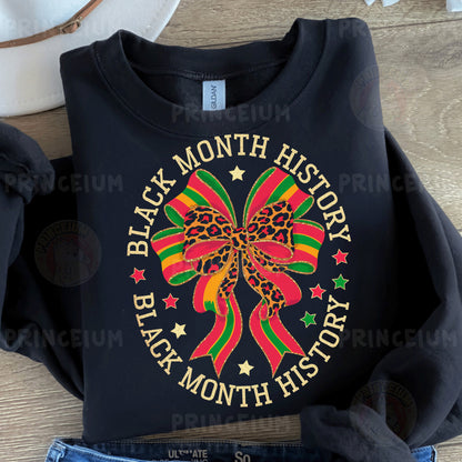 a black shirt with a bow on it