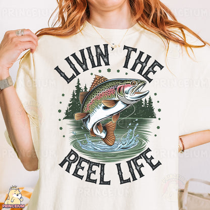 a woman wearing a t - shirt that says livin the reel life
