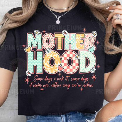 a woman wearing a t - shirt that says motherhood