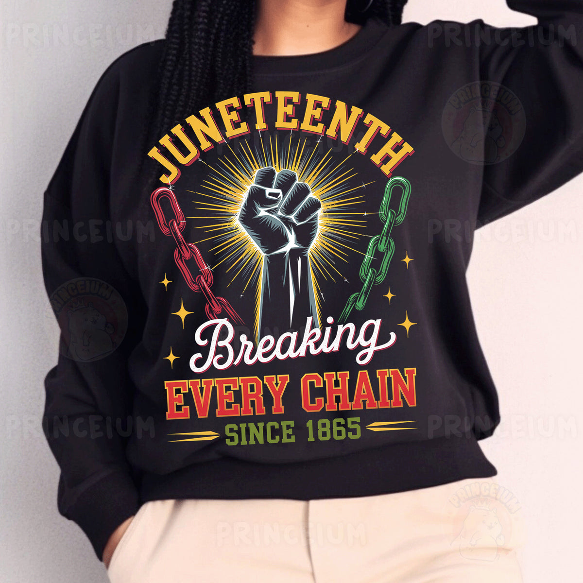 a woman wearing a black sweatshirt with a raised fist