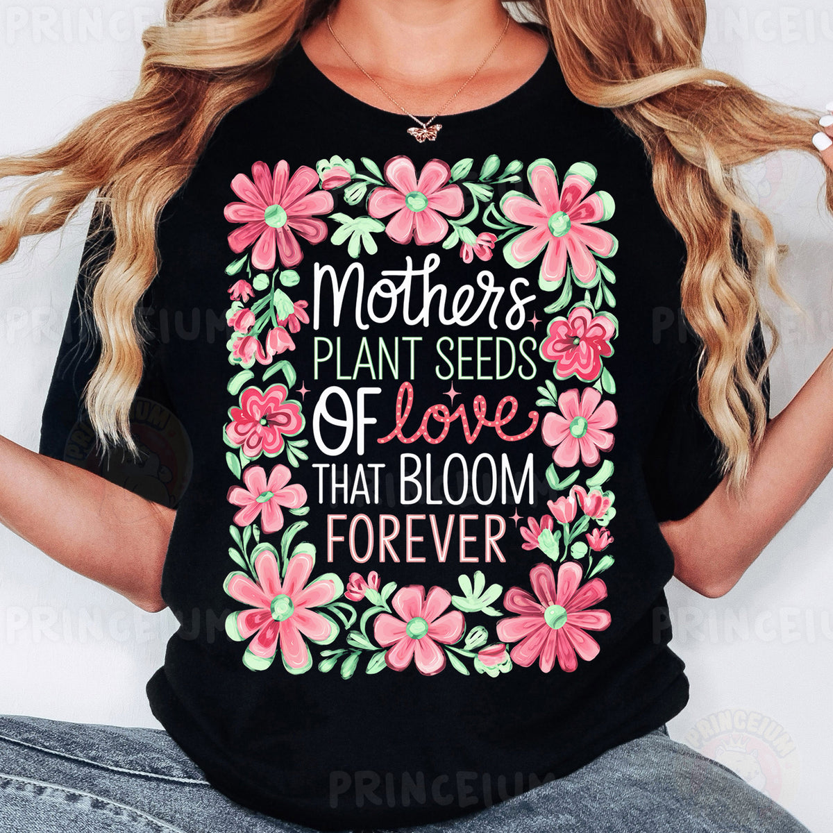 a woman wearing a t - shirt that says mothers plant seeds of love that bloom