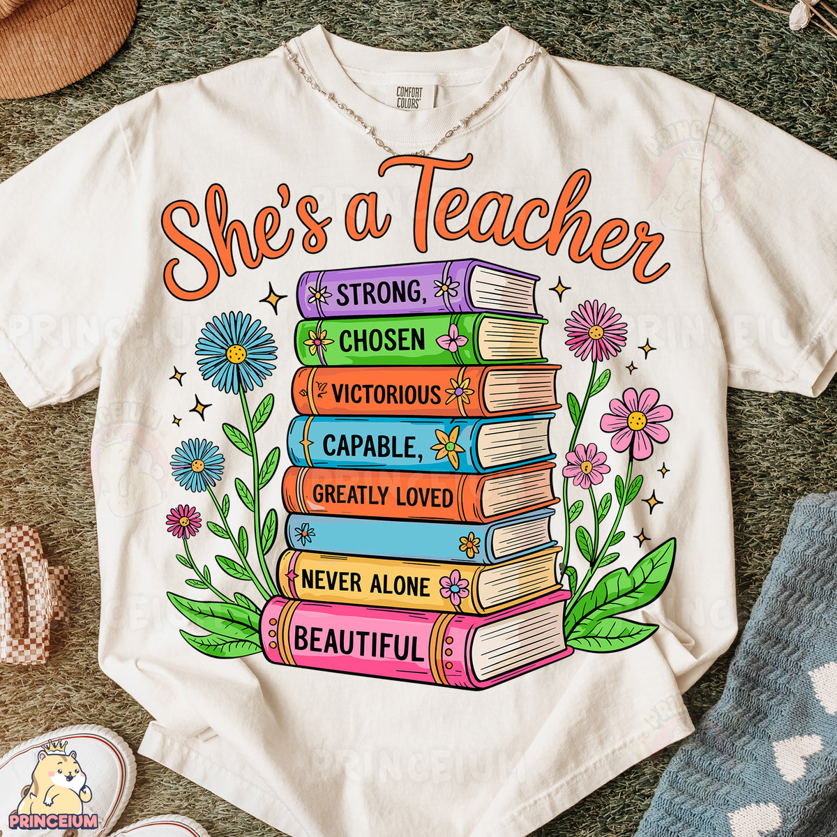 a t - shirt that says she's a teacher with a stack of books