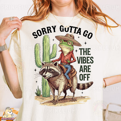 a woman wearing a white shirt with a racoon on it
