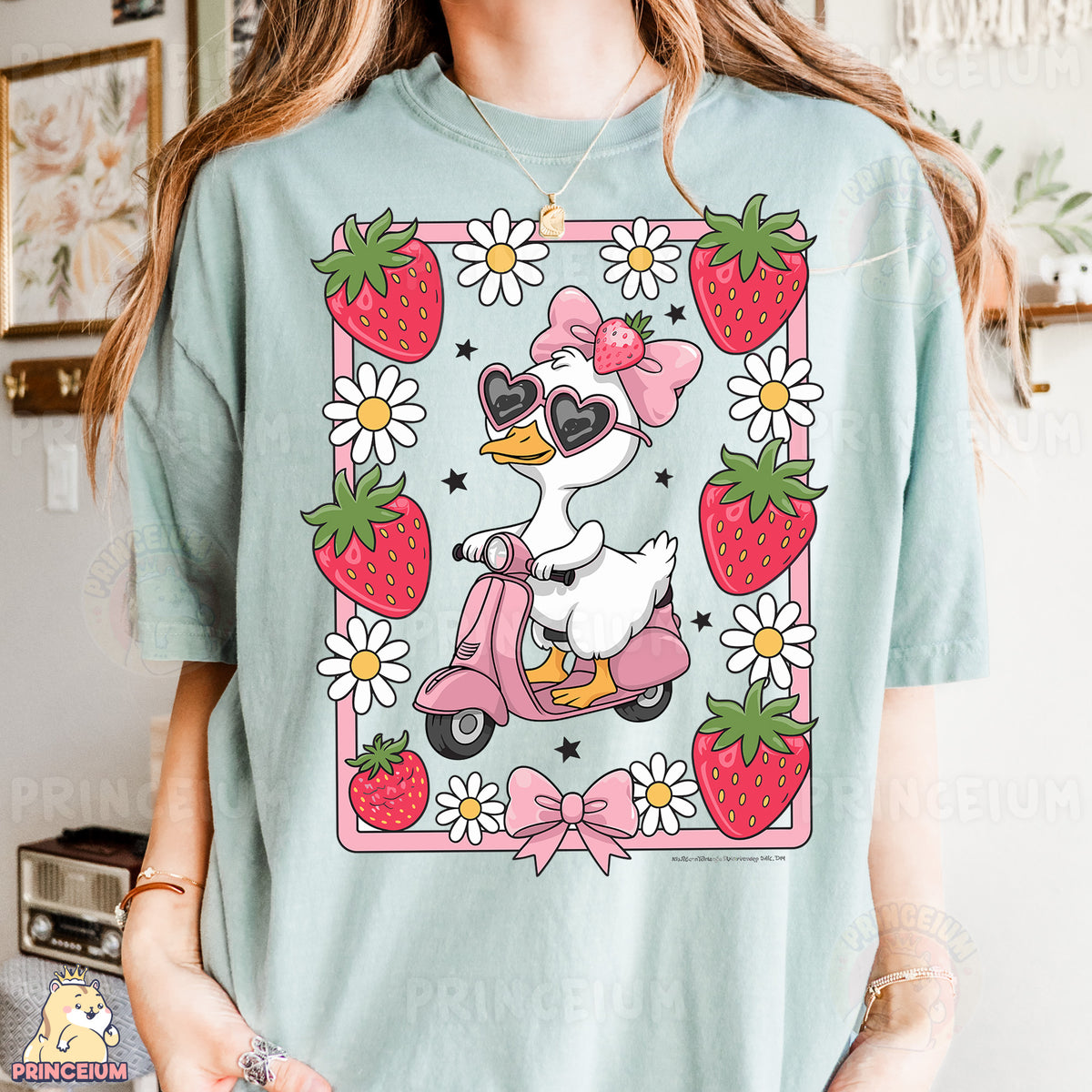 a woman wearing a t - shirt with a duck riding a scooter