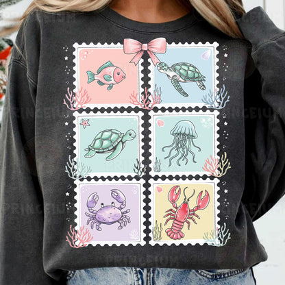a woman wearing a black shirt with stamps on it