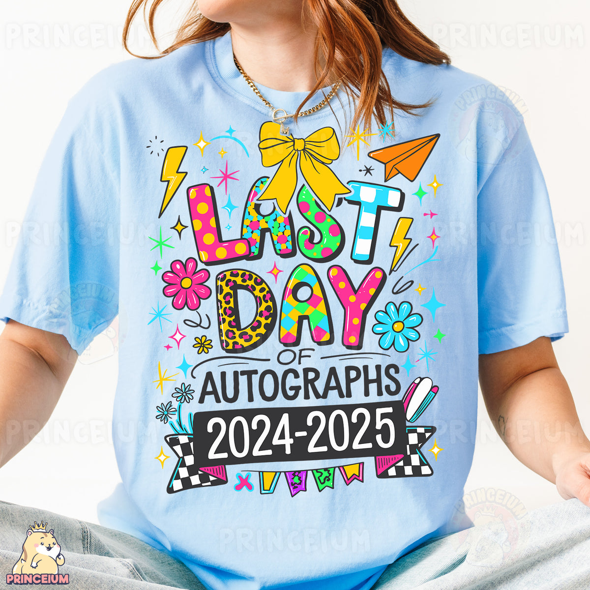 a woman wearing a light blue t - shirt with the words last day of auto