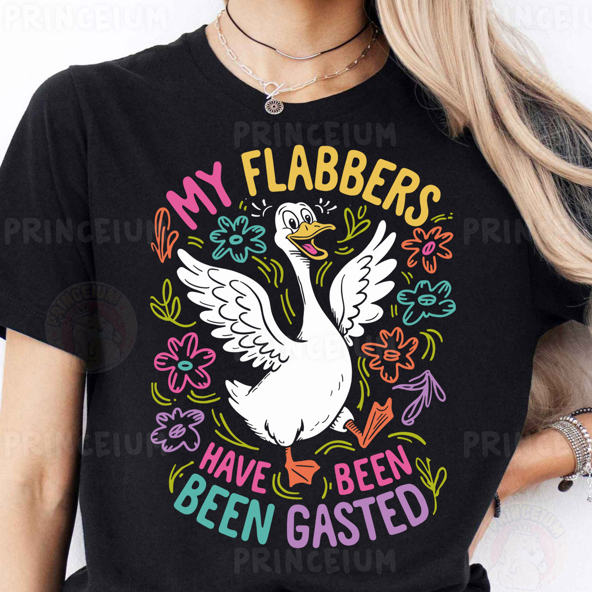 a woman wearing a black shirt with a white goose on it