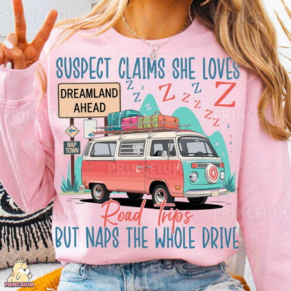 a woman wearing a pink shirt with a vw van on it