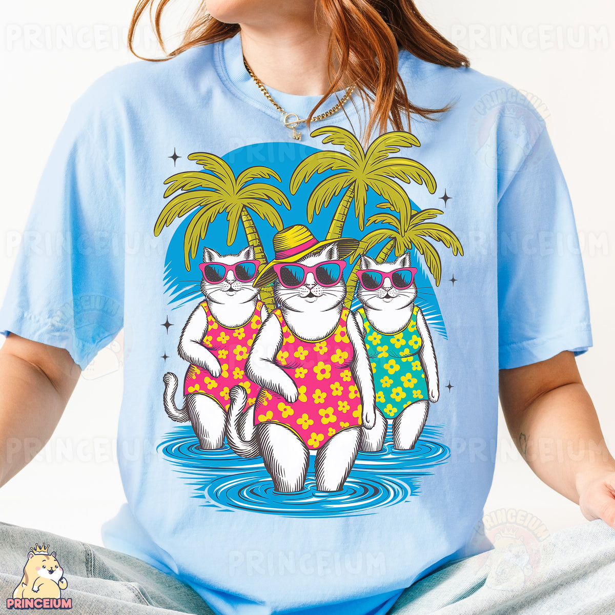 a woman wearing a blue shirt with two cats wearing sunglasses