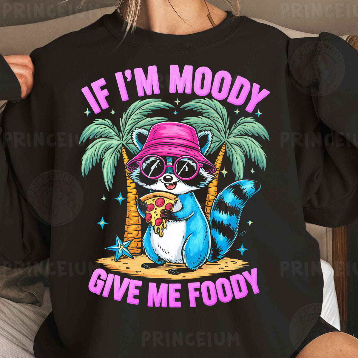 a woman wearing a black shirt with a raccoon wearing a pink hat and