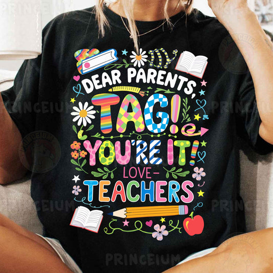 a woman wearing a t - shirt that says dear parents tag you're it