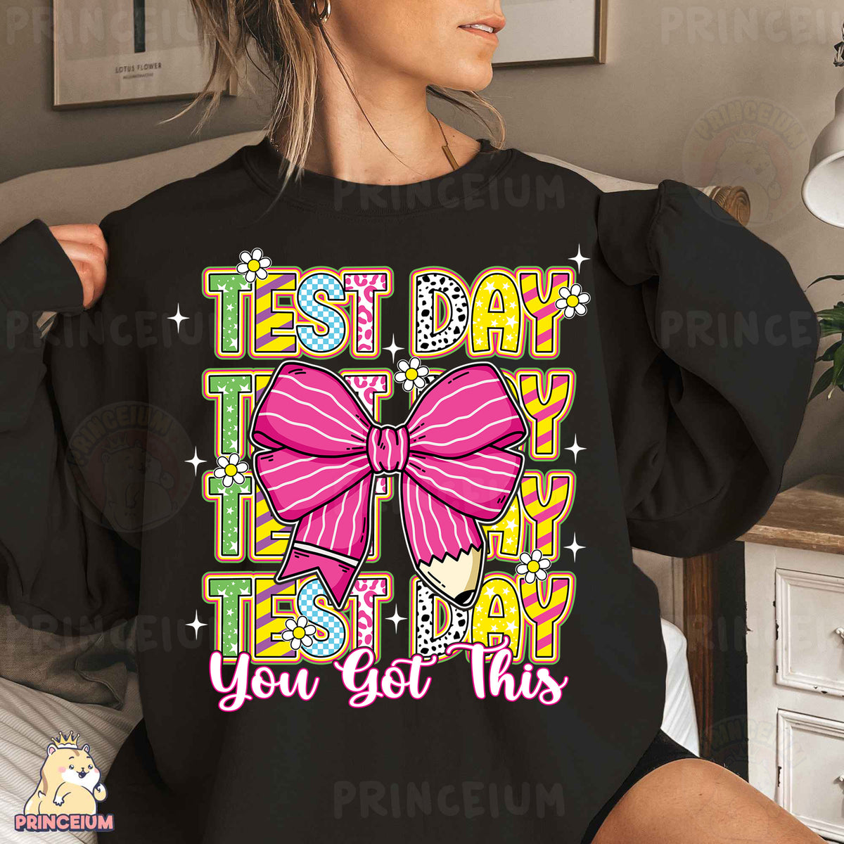 a woman wearing a black shirt with a pink bow on it