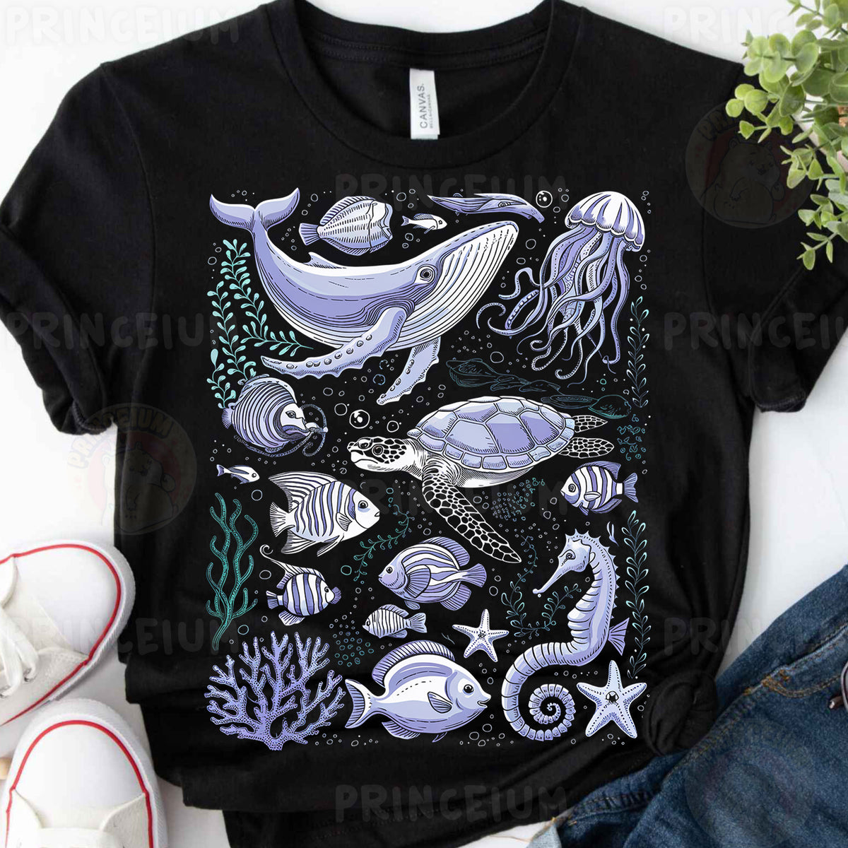 a t - shirt with a picture of a whale and other sea animals