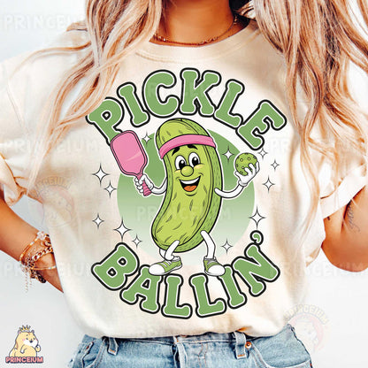 a woman wearing a pickle and balls t - shirt