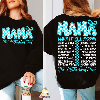a woman wearing a black mama sweatshirt and jeans