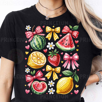 a woman wearing a black t - shirt with fruit and bows on it
