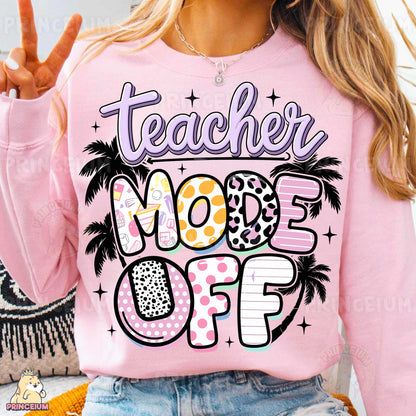 a woman wearing a pink teacher mode sweatshirt