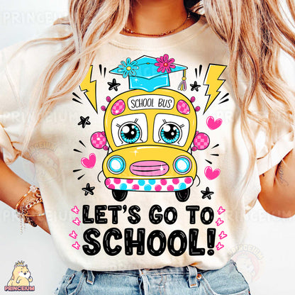 a girl wearing a school bus shirt with the words let's go to school