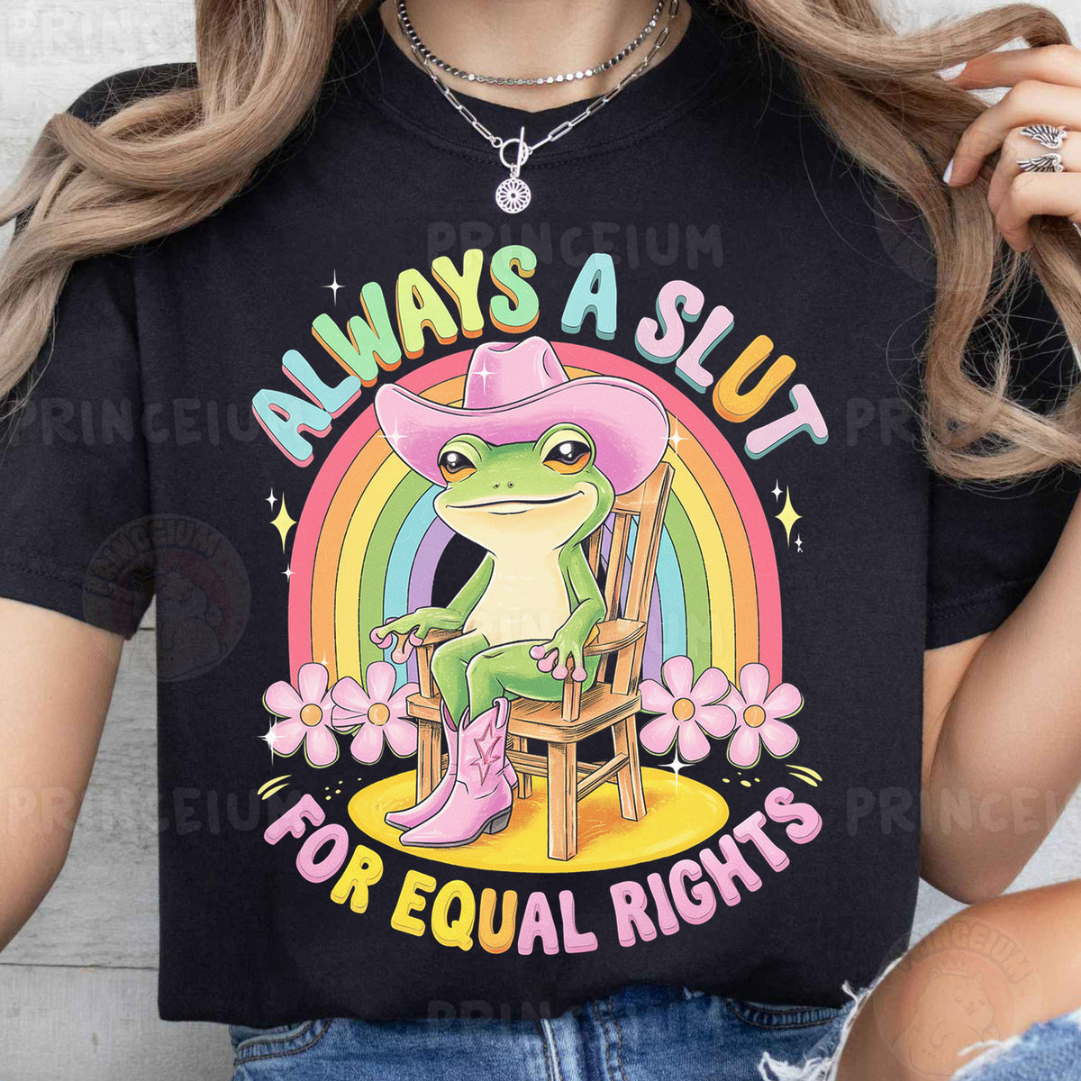 a woman wearing a black shirt with a frog wearing a cowboy hat