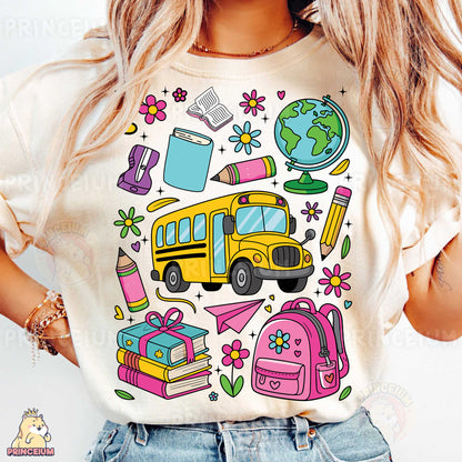 a woman wearing a t - shirt with a picture of a school bus