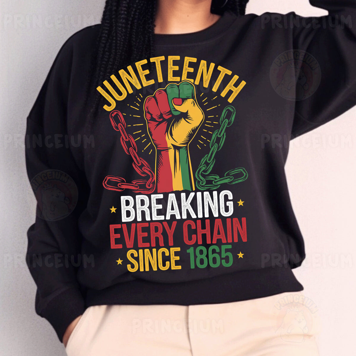 a woman wearing a black sweatshirt with a fist on it