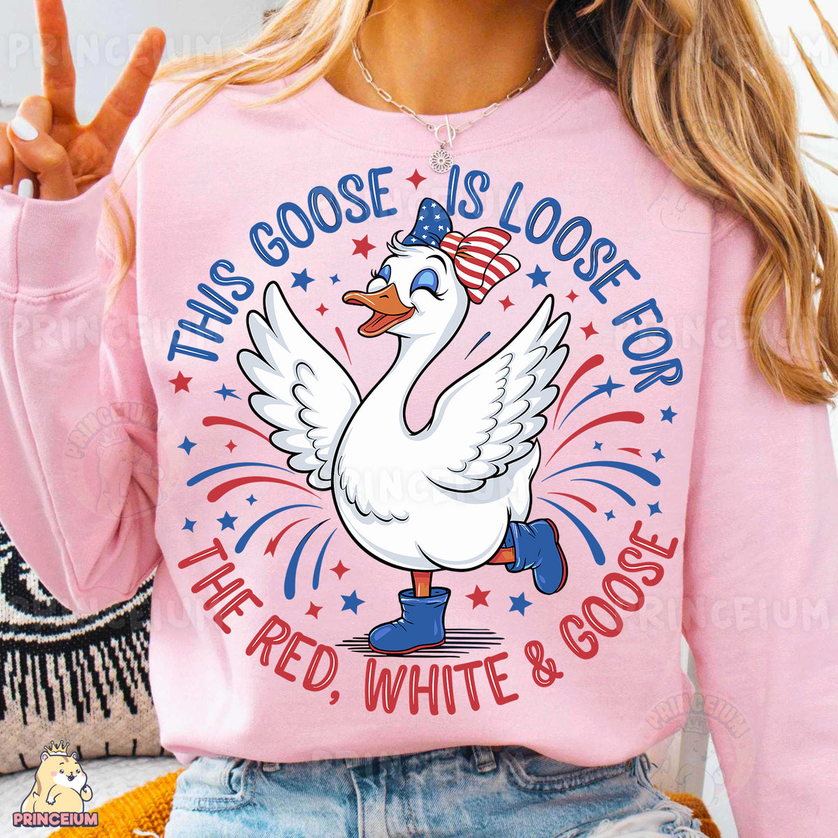 a woman wearing a pink shirt with a goose on it