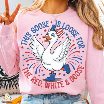 a woman wearing a pink shirt with a goose on it