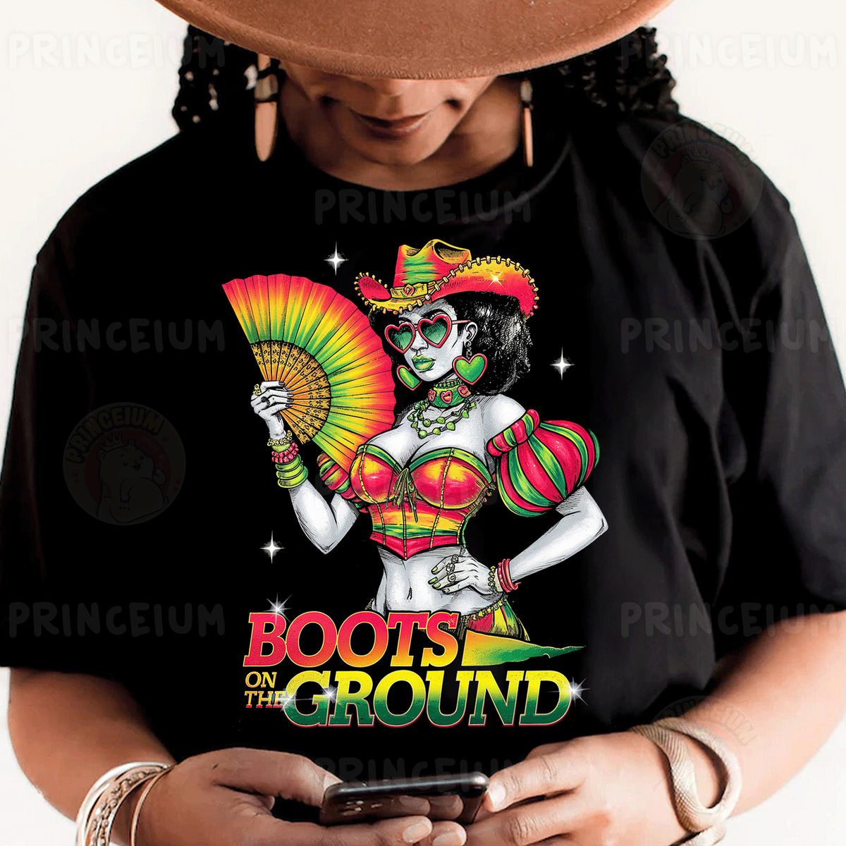 a woman wearing a black shirt and a hat holding a cell phone