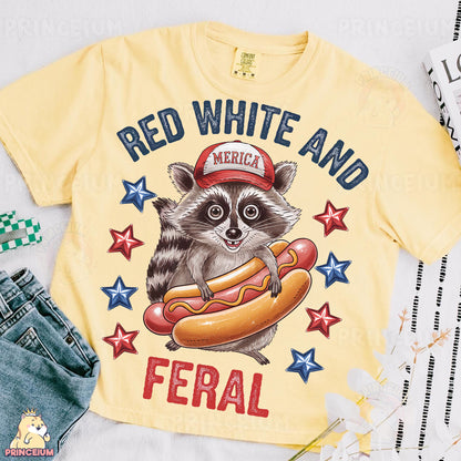 a yellow shirt with a raccoon wearing a red hat and holding a hot