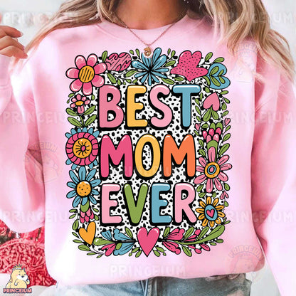 a woman wearing a pink sweatshirt that says best mom ever