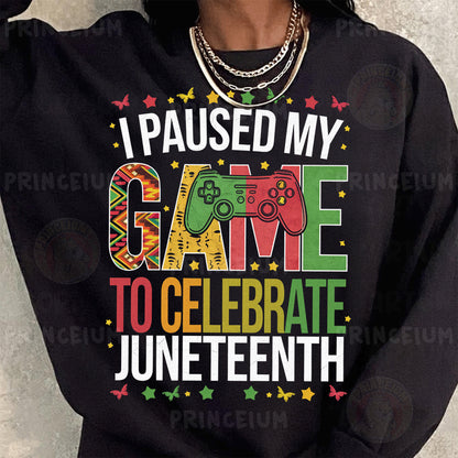 a woman wearing a black sweatshirt that says i paused my game to celebrate junetee