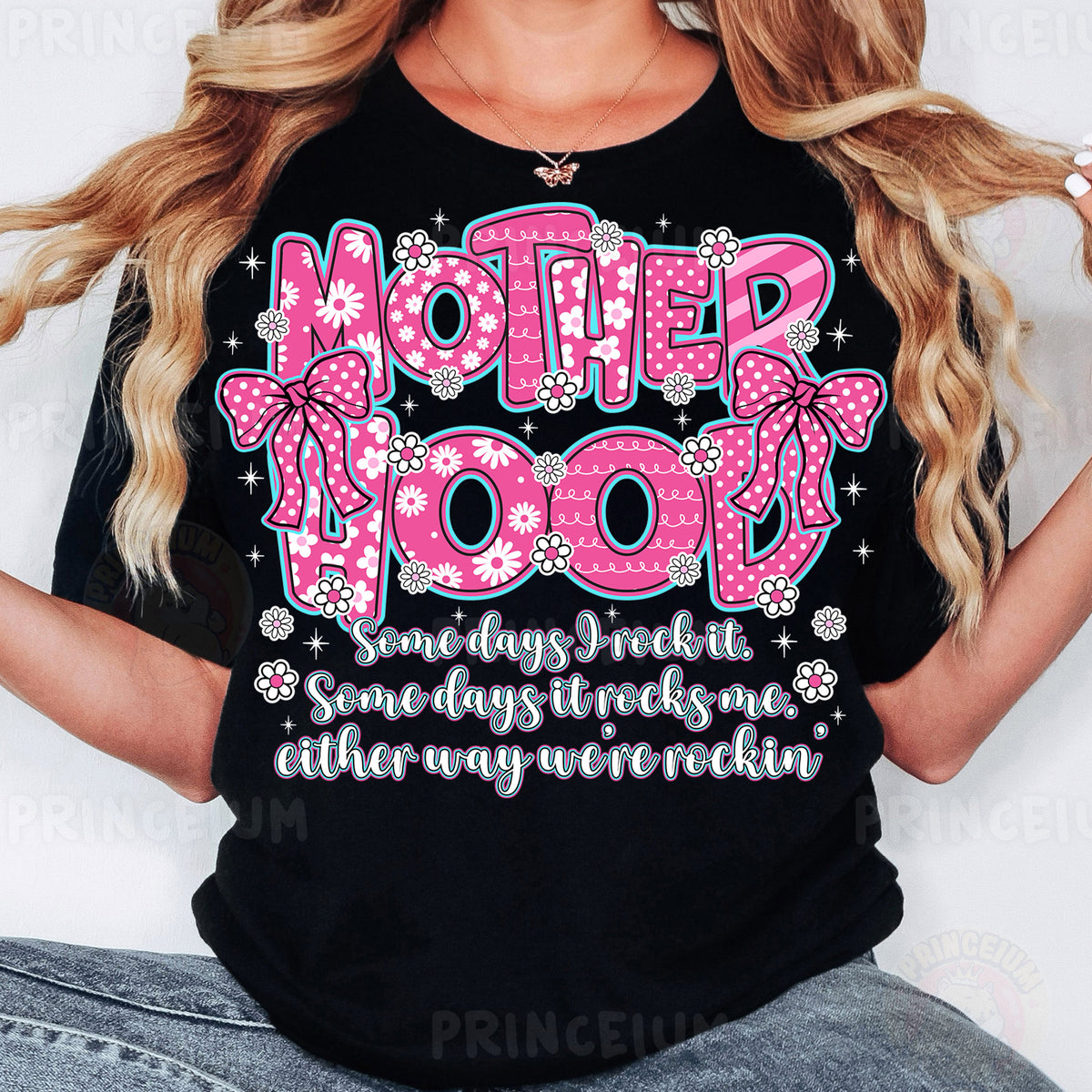 a woman wearing a t - shirt that says motherhood