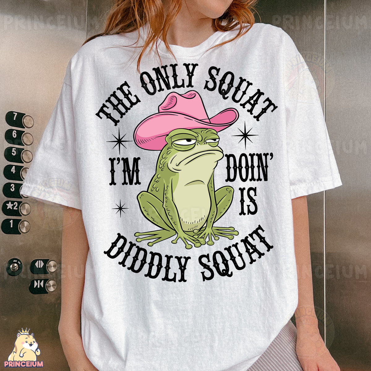 a woman wearing a white shirt with a frog wearing a pink hat