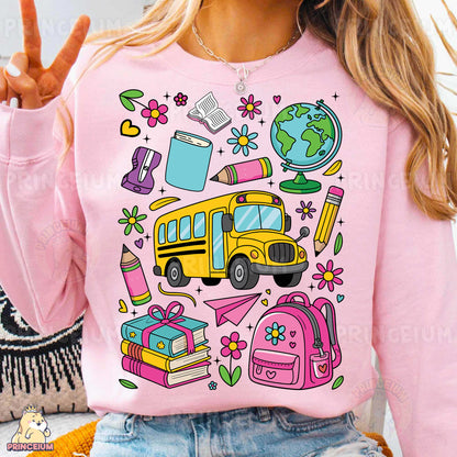 a woman wearing a pink shirt with a school bus on it