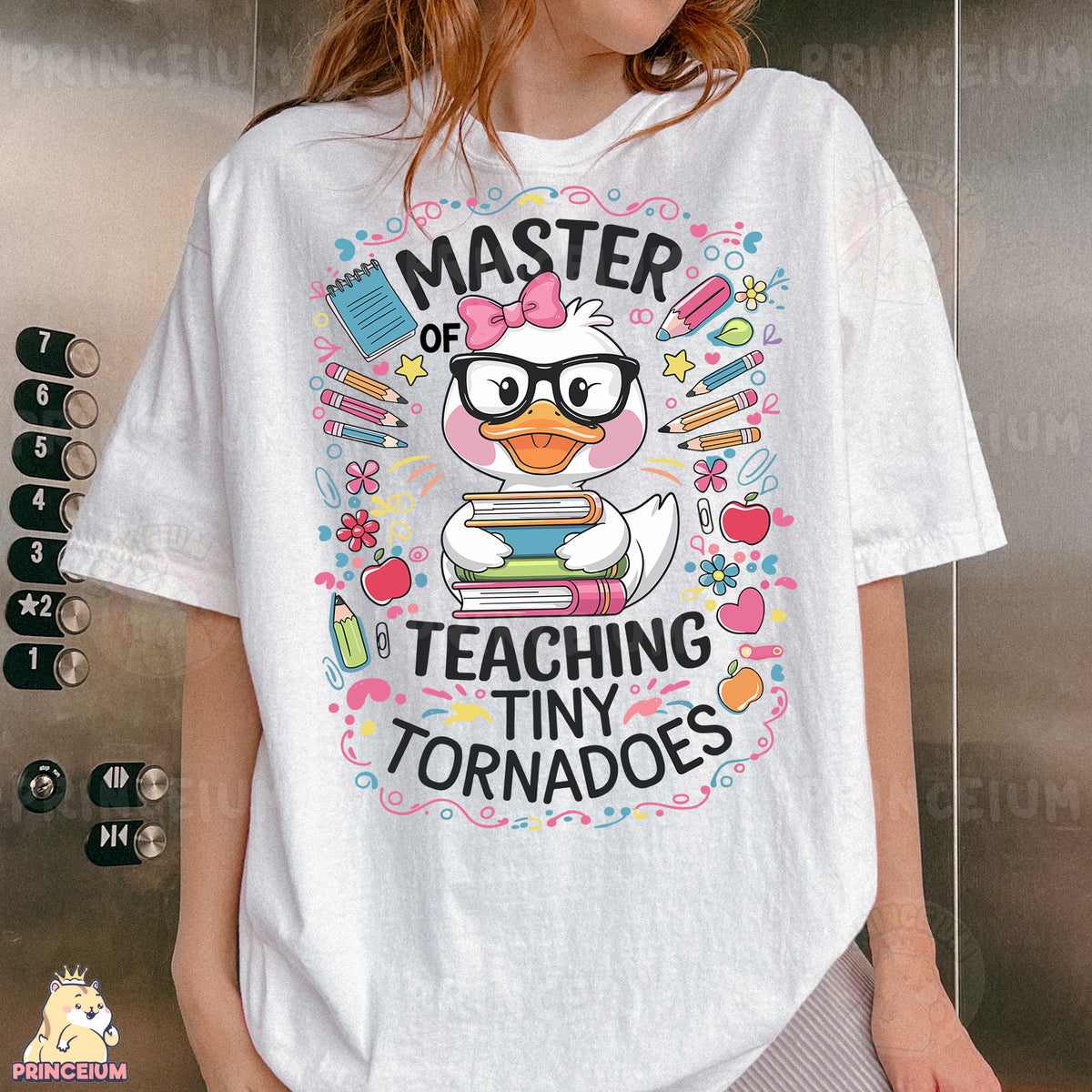 a woman wearing a t - shirt that says master of teaching tiny tornados