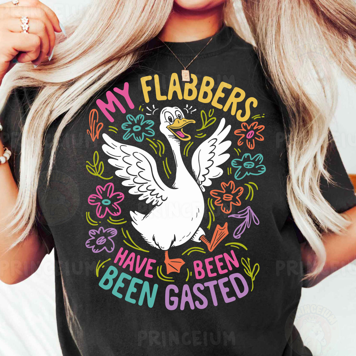 a woman wearing a black shirt with a white goose on it