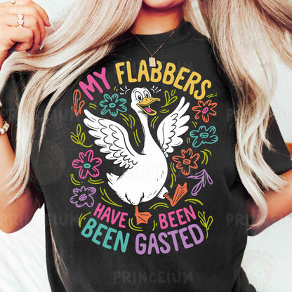 a woman wearing a black shirt with a white goose on it