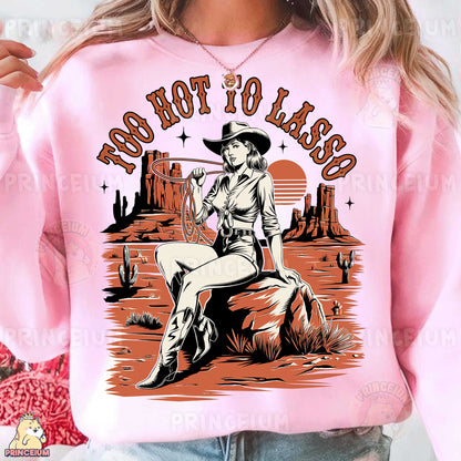 a woman wearing a pink shirt with a cowboy on it