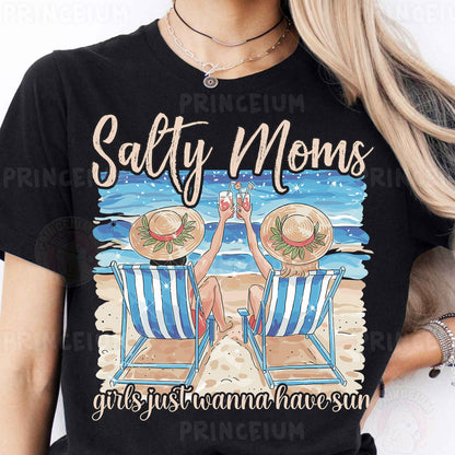 a woman wearing a black shirt with a picture of two chairs on the beach