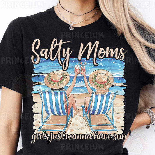 a woman wearing a black shirt with a picture of two chairs on the beach