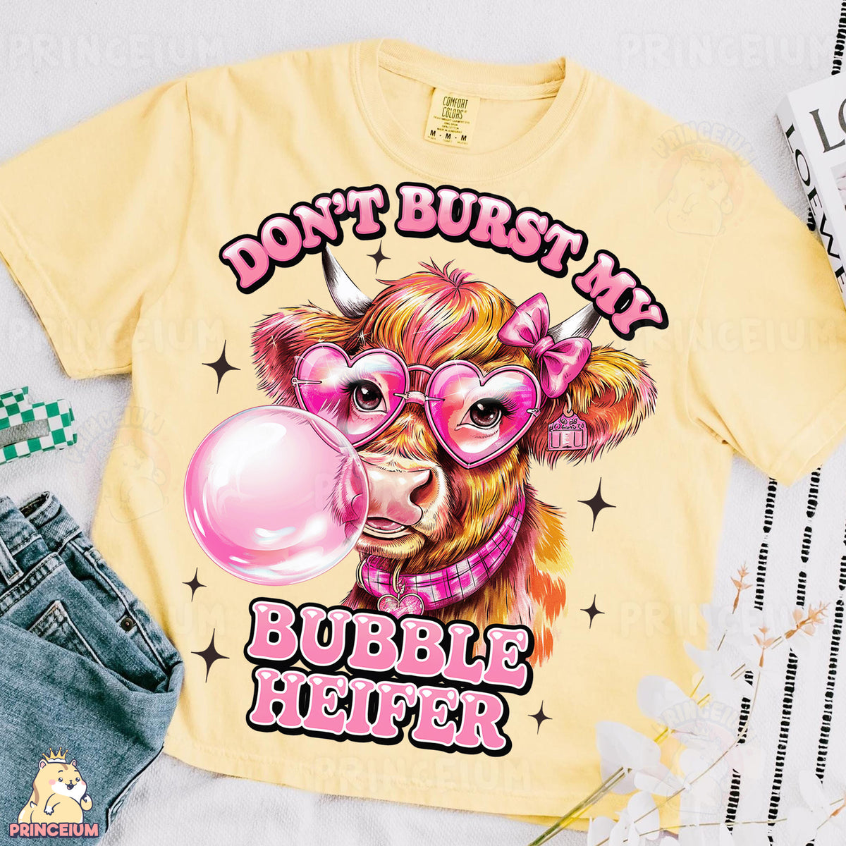 a t - shirt with a cow wearing glasses and a bubble