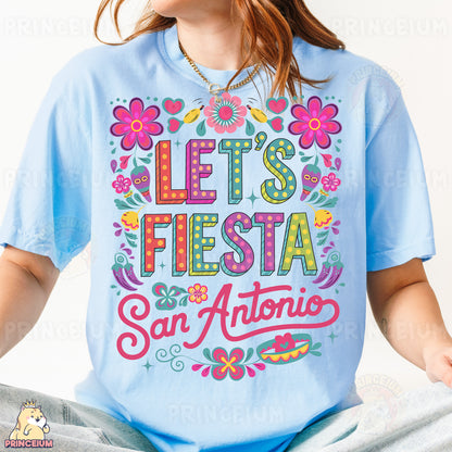 a woman wearing a blue shirt that says let's fiesta