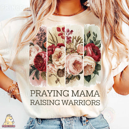 a woman wearing a t - shirt that says praying mama raising warriors