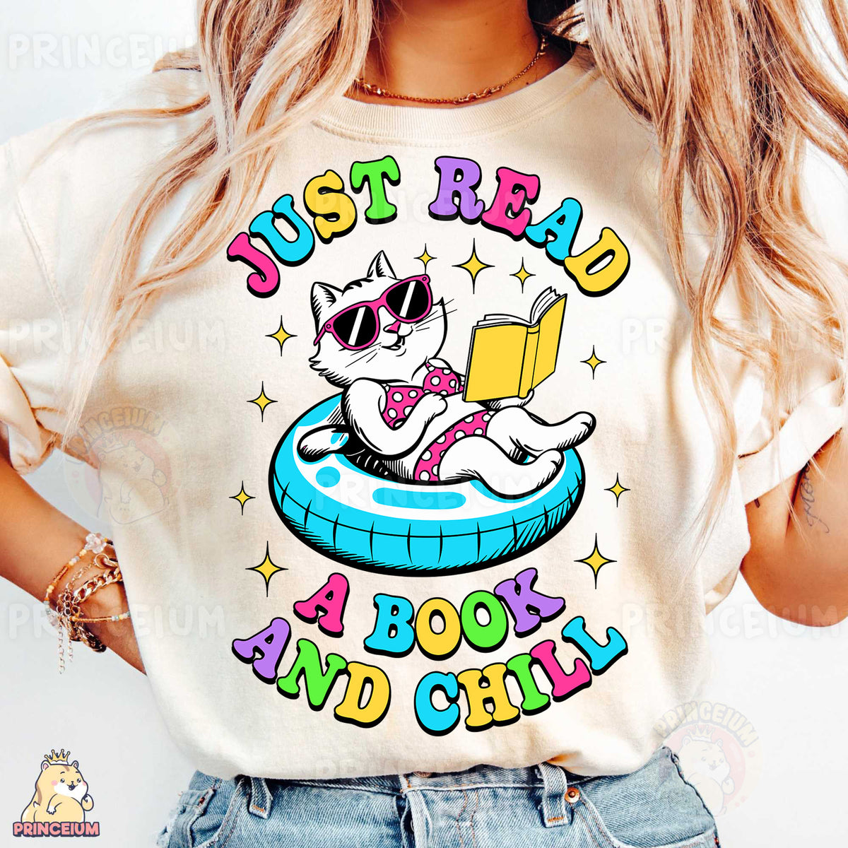 a woman wearing a t - shirt with a cat reading a book